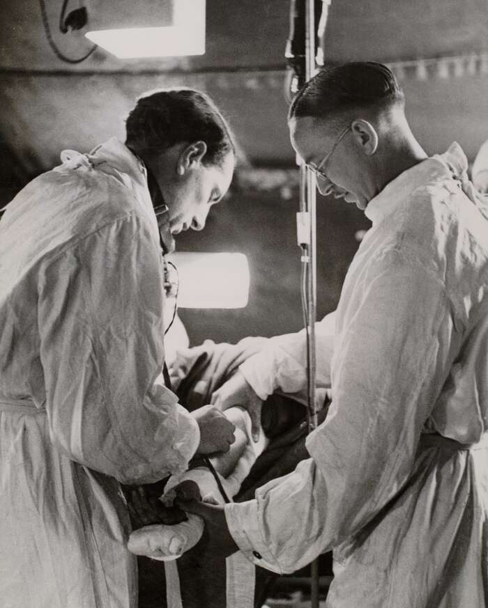 Wounded soldier receiving blood transfusion at a casualty clearing station in Normandy, 1944
