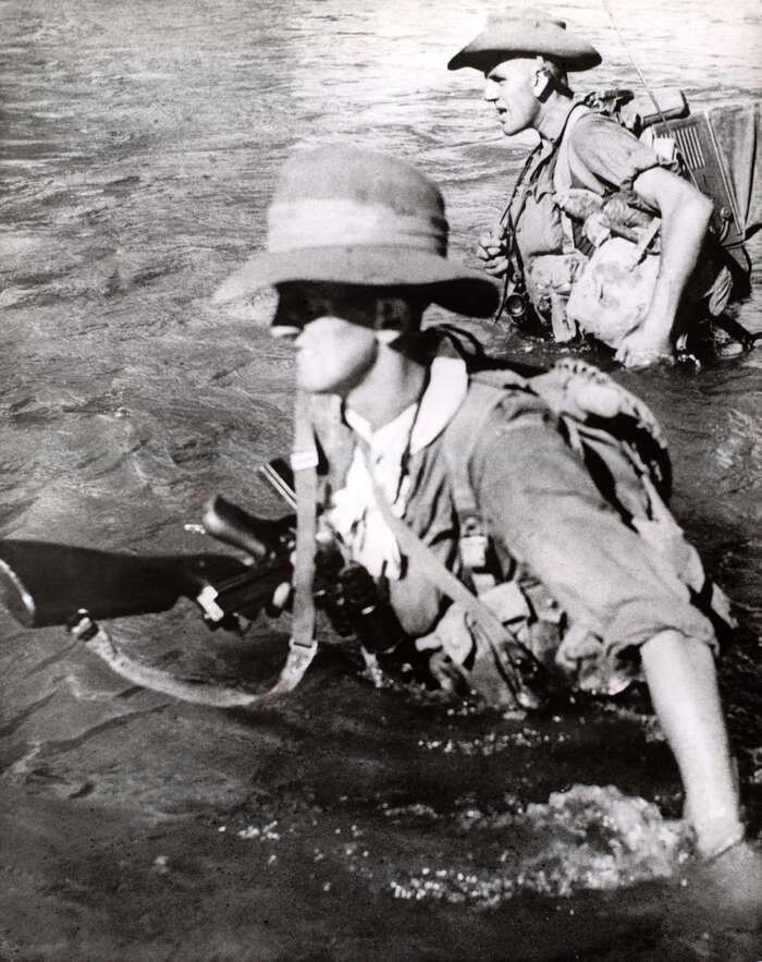 British soldiers fording river in Burma, 1944