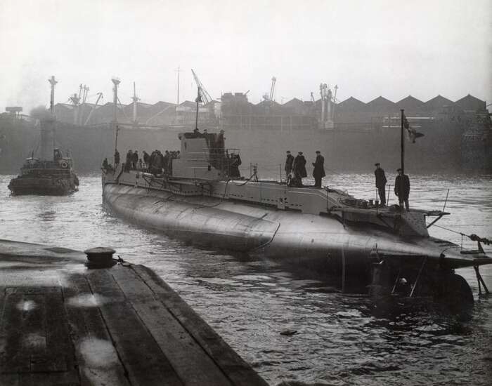 Submarine in shipyard basin, c 1944
