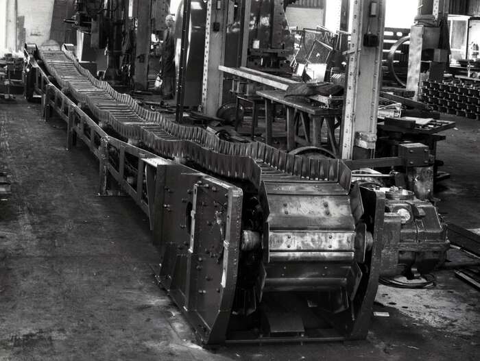 Conveyor belt in workshop, 1960s