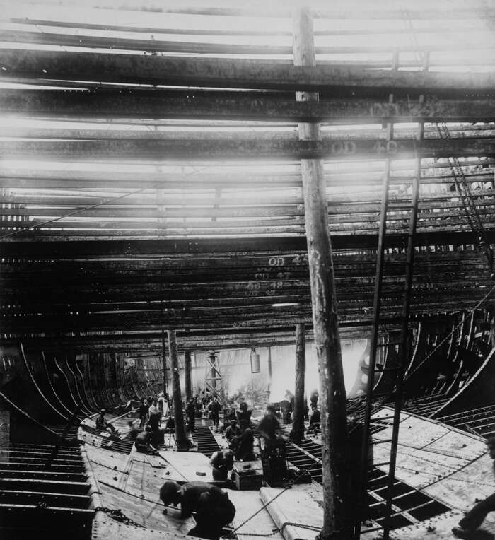 Men at work on the hull bottom of the SS City of New York, 1889