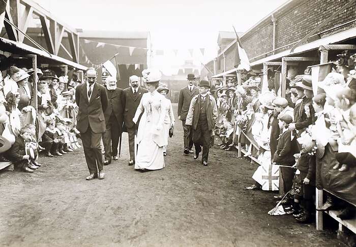 Queen Mary greeted by the crowd
