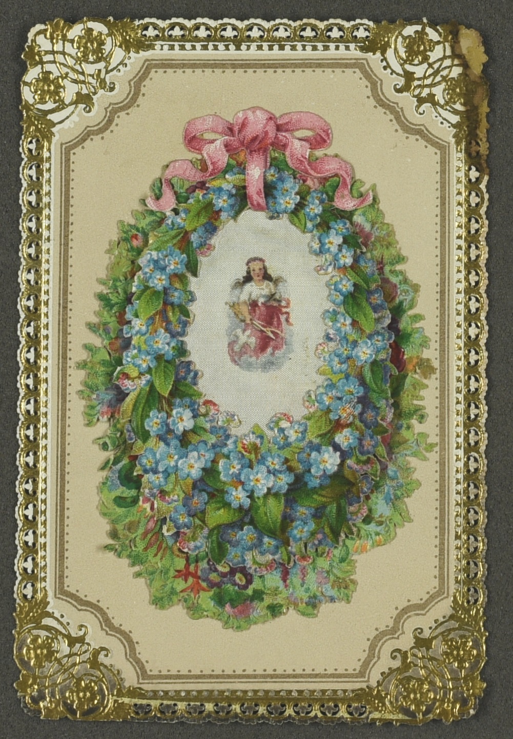 Christmas greetings card depicting a floral wreath and angel