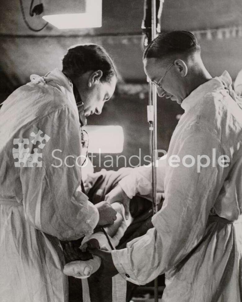 Wounded soldier receiving blood transfusion at a casualty clearing station in Normandy, 1944