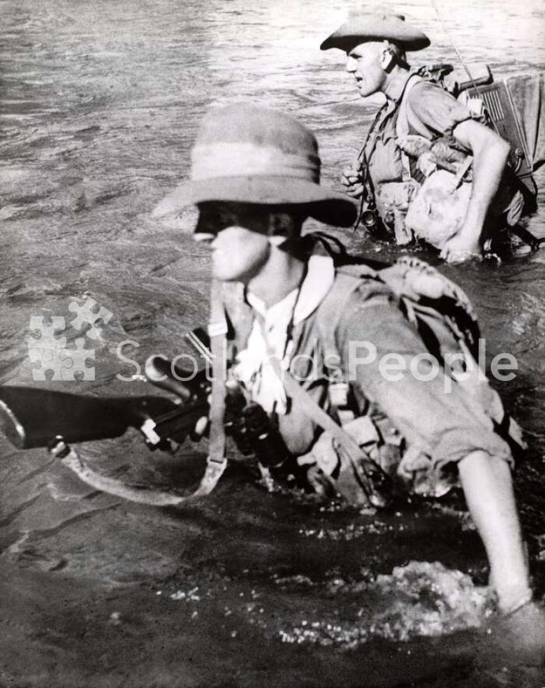 British soldiers fording river in Burma, 1944