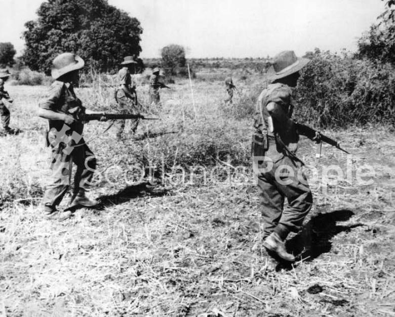 British soldiers advancing through countryside in South East Asia, c 1944-1945