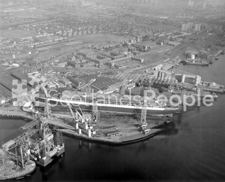 Aerial view of Queen Elizabeth 2 under construction on Clydebank, 1967