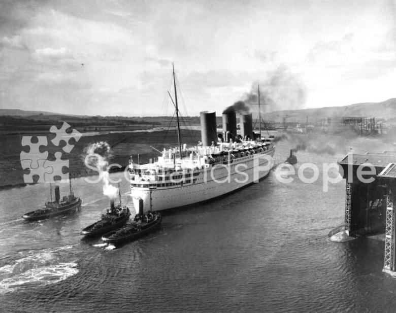 The Canadian Pacific Line ocean liner the RMS Empress of Britain on the River Clyde leaving Clydebank