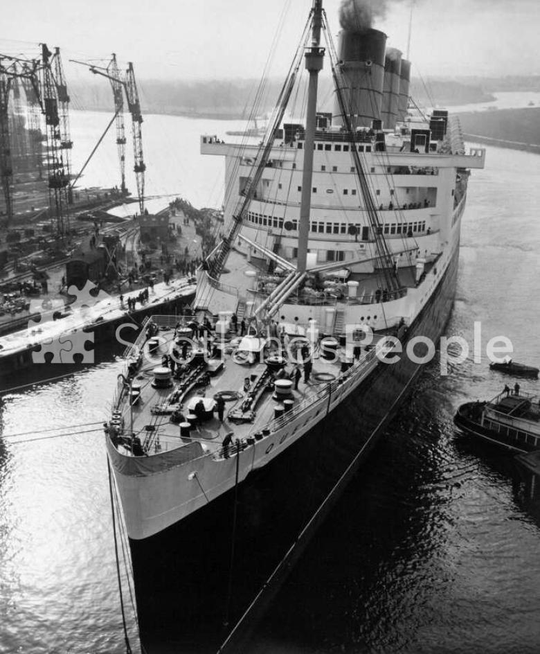 The Cunard Line ocean liner RMS Queen Mary leaving Clydebank Dock