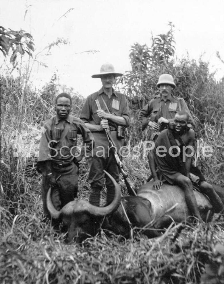 Hunters and Masai with a buffalo, Kenya, 1910