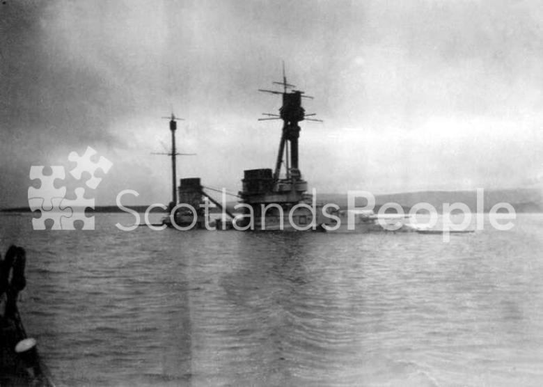 The German Derfflinger Class battlecruiser SMS Hindenburg half submerged at Scapa Flow after being scuttled on 21 June 1919