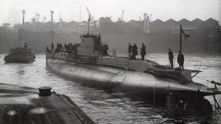 Submarine in shipyard basin, c 1944