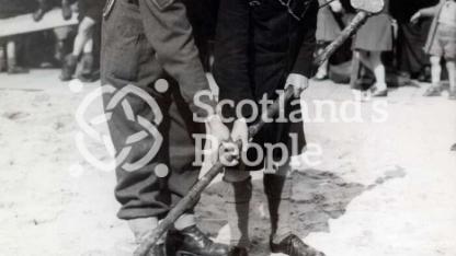 Soldier and boy with mine detector, 1944 Soldier and boy with mine detector, 1944