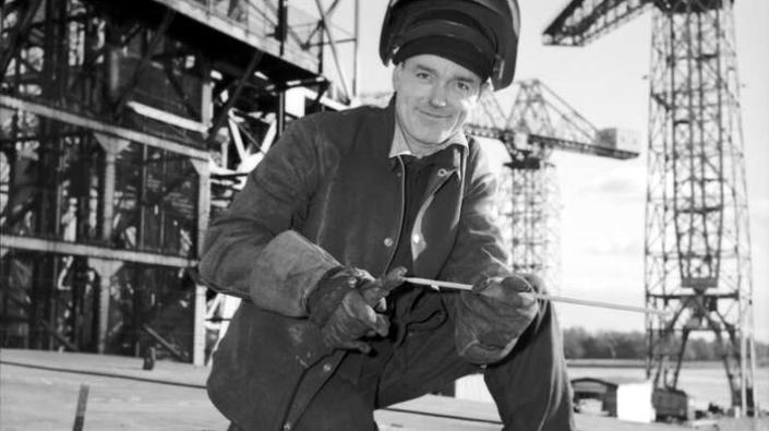 Welder smiles for the camera, Clydebank, 1965