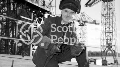 Welder smiles for the camera, Clydebank, 1965