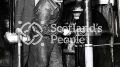 Men removing drilled core on boring tower in the Forth, 1955 Men removing drilled core on boring tower in the Forth, 1955