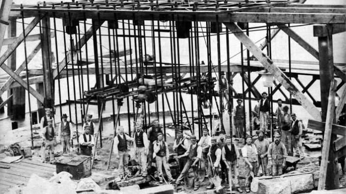 Workers by Forth Bridge pier during construction, 1884