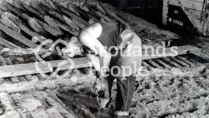 Worker at Carron Works, 20th century Worker at Carron Works, 20th century
