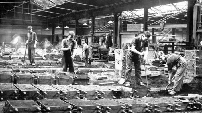 Workmen lining moulds at Carron Works, 20th century