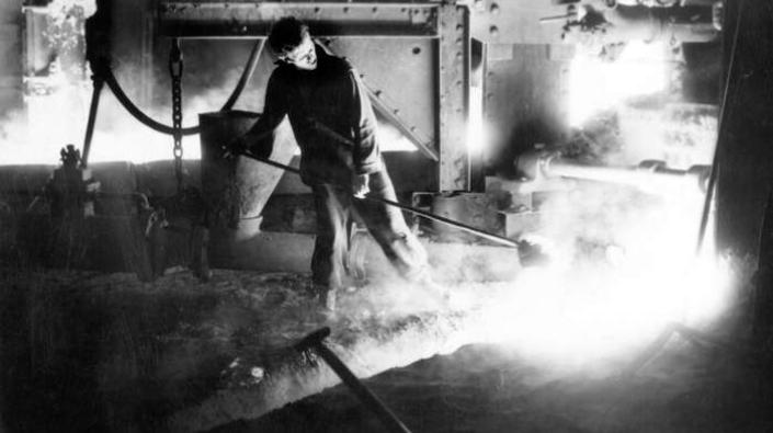Workman with ladle at Carron Works, 20th century
