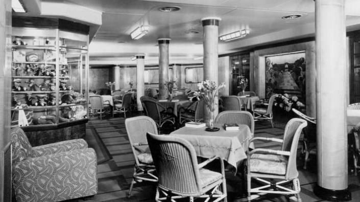 The Third Class Garden Lounge looking to port on board the Cunard Line ocean liner RMS Queen Mary