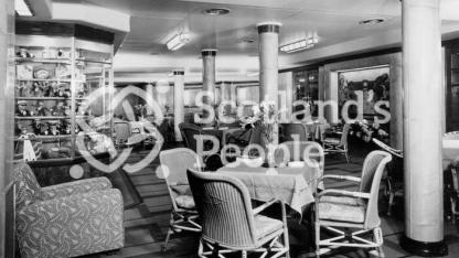 The Third Class Garden Lounge looking to port on board the Cunard Line ocean liner RMS Queen Mary The Third Class Garden Lounge looking to port on board the Cunard Line ocean liner RMS Queen Mary