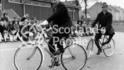 Actors Peter Byrne and Geoffrey Adams riding bicycles, 1967 Actors Peter Byrne and Geoffrey Adams riding bicycles, 1967