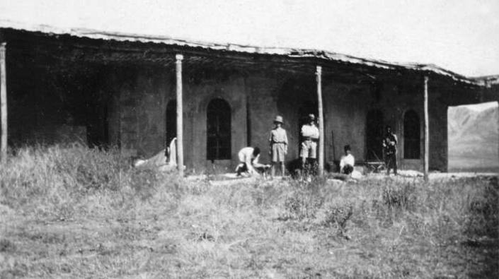 Bearers packing up outside the political bungalow at Mosul, Northern Iraq, 1926