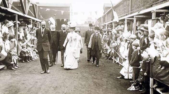 Queen Mary greeted by the crowd