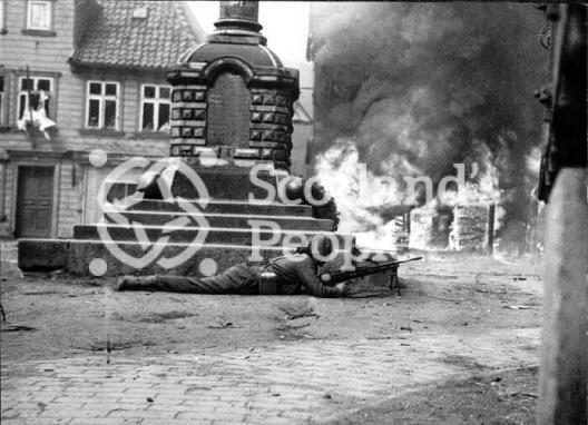 A gunner takes cover during the battle for the Rhine April 1945 A gunner takes cover during the battle for the Rhine April 1945