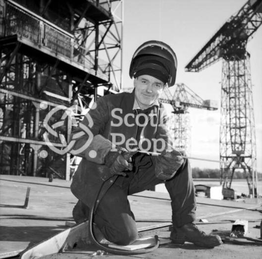 Welder smiles for the camera, Clydebank, 1965 Welder smiles for the camera, Clydebank, 1965