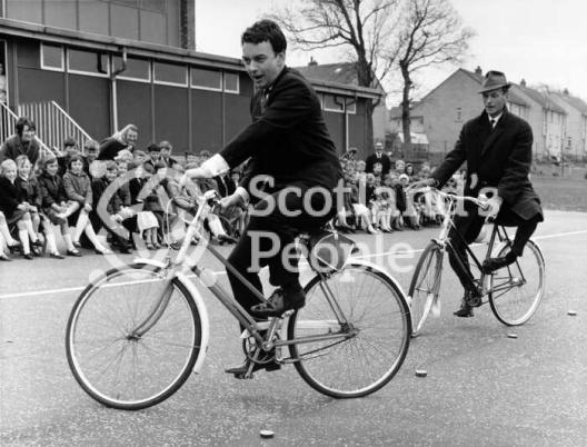 Actors Peter Byrne and Geoffrey Adams riding bicycles, 1967 Actors Peter Byrne and Geoffrey Adams riding bicycles, 1967