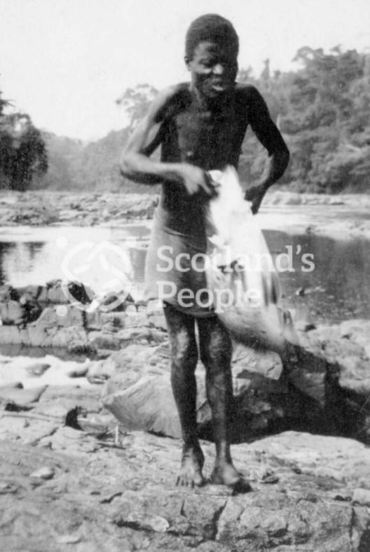 A Cameroonian with a goose near Bakebbi, Cameroon A Cameroonian with a goose near Bakebbi, Cameroon