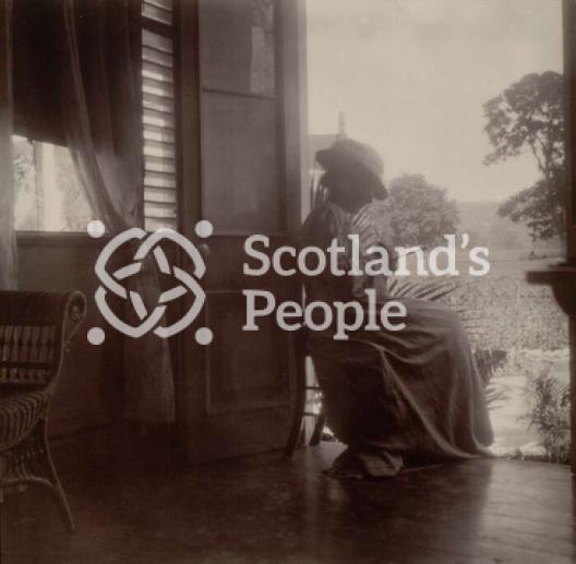 Woman sitting at open doorway, 1905 Woman sitting at open doorway, 1905