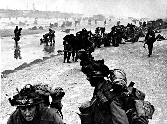 A photograph of British soldiers on a Normandy beach on D-Day, 1944.