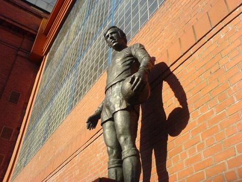 The statue of John Greig, former Rangers player, outside the Ibrox Stadium. A memorial to those who died in the disaster.