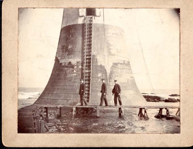 Three Lightkeepers outside of The Bell Rock Lighthouse. One is believed to be John Henderson (1864-1939), c1900-1919. Courtesy of the Morrison Family.