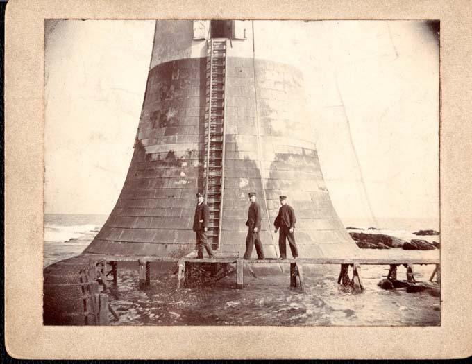 Three Lightkeepers outside of The Bell Rock Lighthouse. One is believed to be John Henderson (1864-1939), c1900-1919. Courtesy of the Morrison Family.