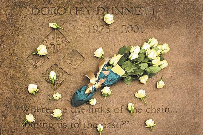 Dorothy Dunnett’s memorial stone with a floral tribute in the Makars’ Court