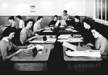 Women typing in office