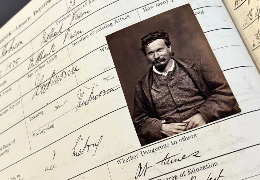 Photograph of a case note from Perth Prison, showing handwritten notes and the image of a male patient