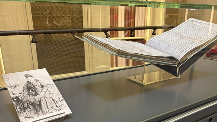 Display cabinet showing black and white archival photograph of Gaelic poet Mary MacPherson (known as Màiri Mhór nan Òran) and original records tracing moments in the poet's life.